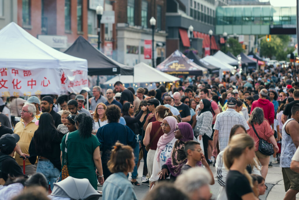 Crowds of people lining King Street East during the Far East Asian Night Market 