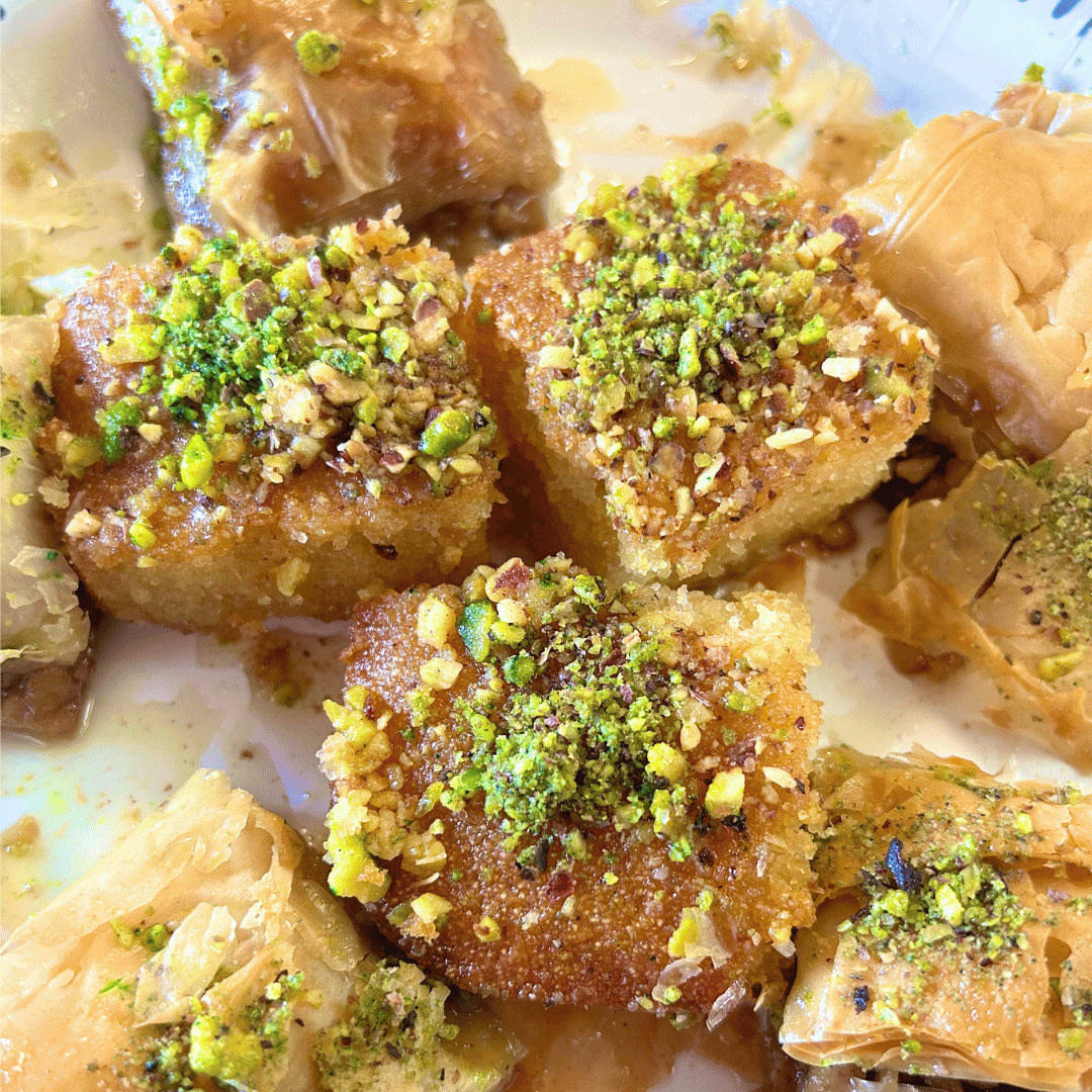 Baklava, a rich, sweet pastry made of paper-thin layers of phyllo (filo) dough, filled with chopped nuts and sweetened with honey or simple syrup. Vendor: Turkish Cuisine
