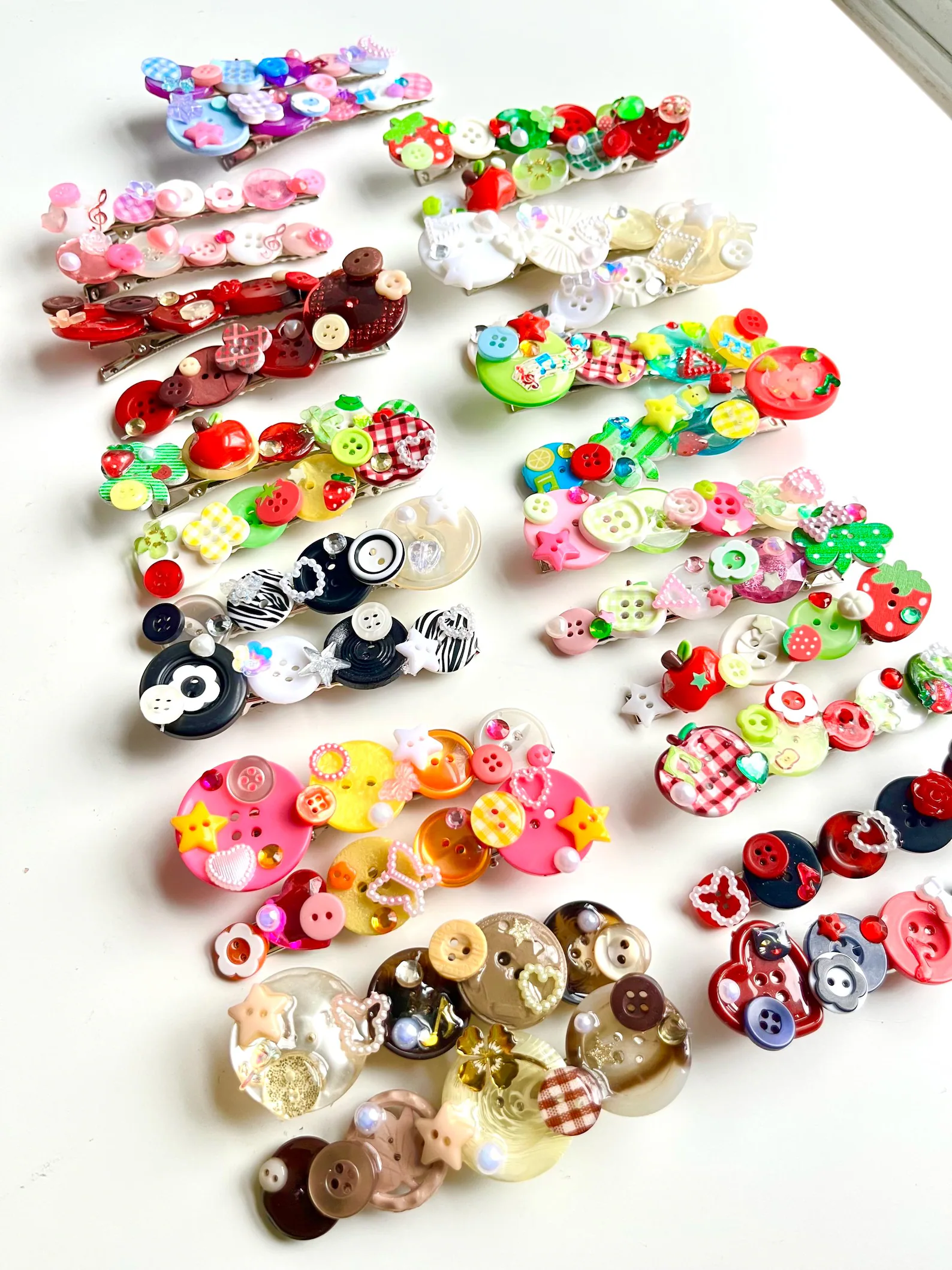 Handmade hair barrettes made with buttons. Vendor: Ichigo Mart 