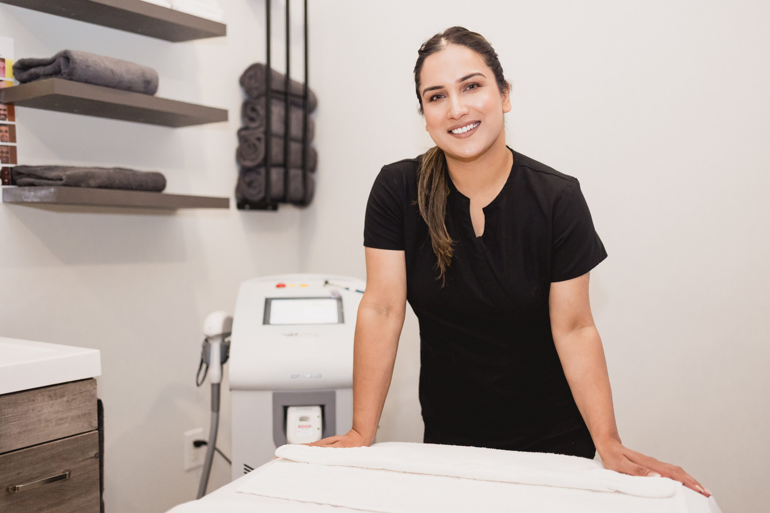 Staff member posing in a medical spa. Vendor: Karma Medi Spa