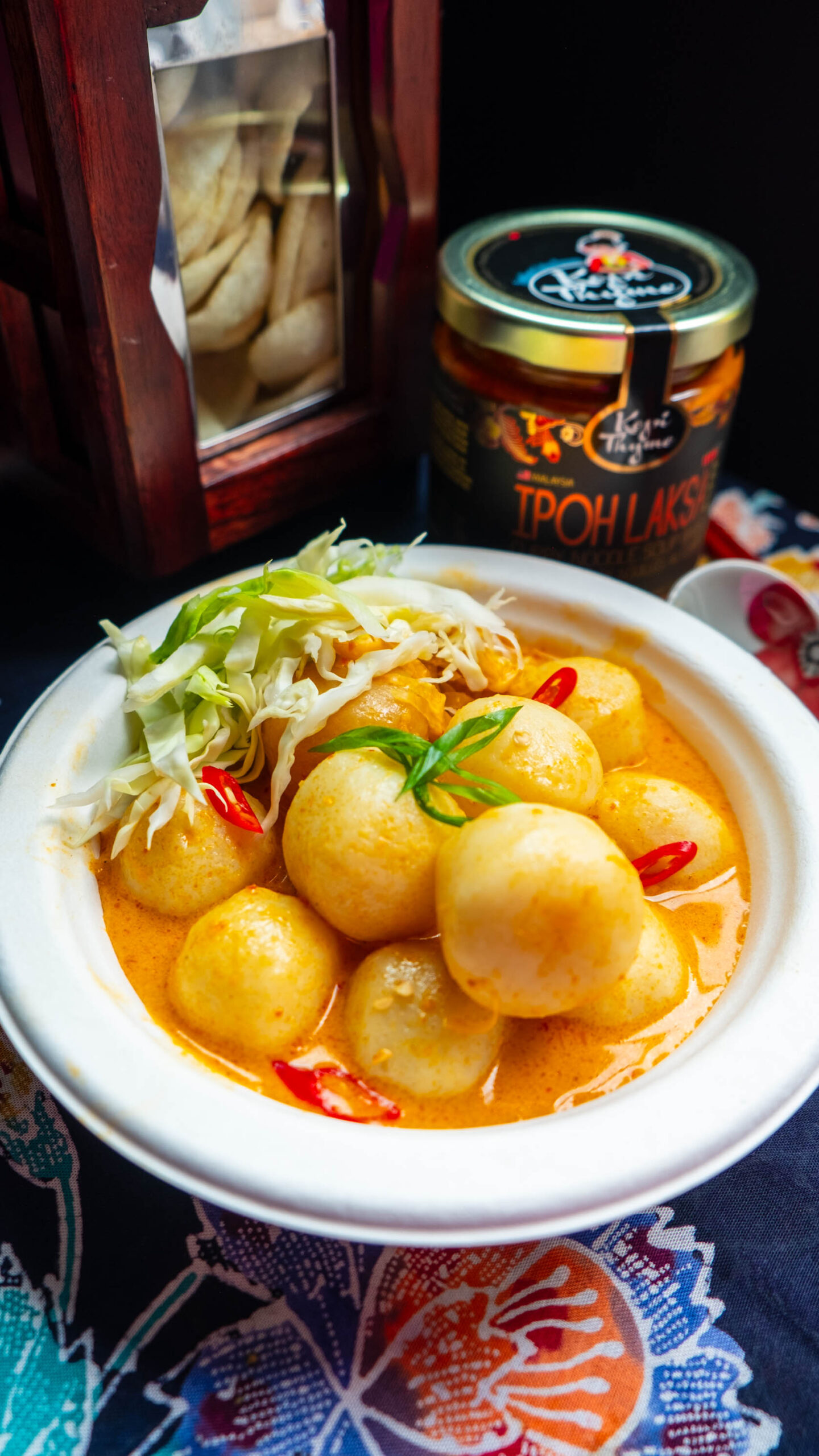 Fish balls plated with fresh garnish. Vendor: Kopi Thyme