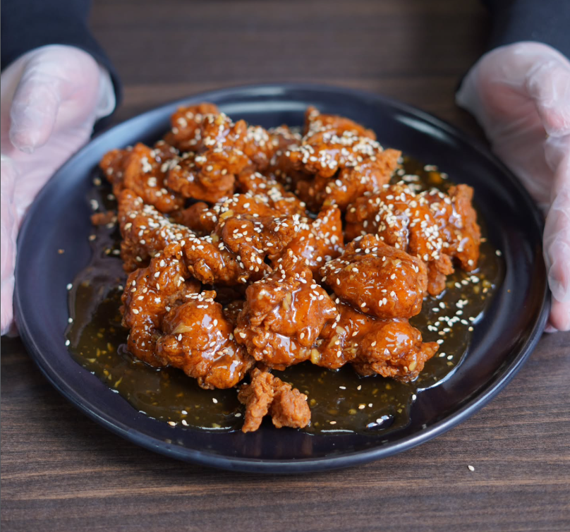 Crispy chicken bites tossed in our sweet golden honey sesame sauce with the perfect balance of crunch, sweetness, and heat. Vendor" Big D's Hot Chicken