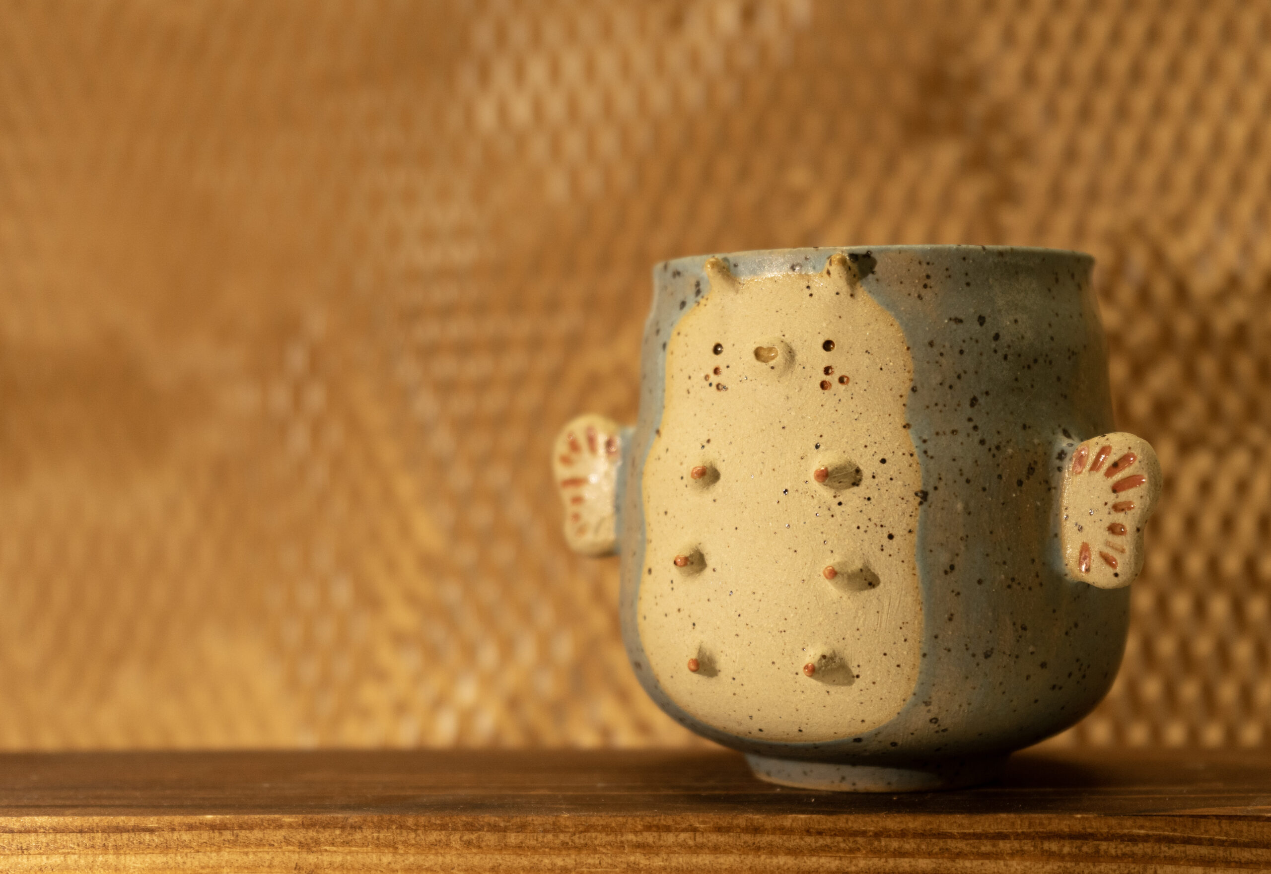 The cuties little ceramic cup in the shape of a finned sea creature. Vendor: Mii Studios